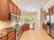 Modern kitchen featuring stainless steel appliances, and plenty of counter space at 15 Cambridge Trce, Ormond Beach, FL 32174