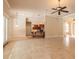 Bright and open living space with tile flooring, a breakfast bar, and adjacent dining area, perfect for entertaining at 15 Cambridge Trce, Ormond Beach, FL 32174