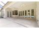 Expansive covered patio area with many entry points to the backyard pool at 15 Cambridge Trce, Ormond Beach, FL 32174