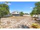 Expansive backyard featuring a screened lanai and ample space for outdoor activities at 1561 Randolph St, Deltona, FL 32725