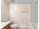Clean bathroom with white fixtures, a shower/tub combo, and neutral wall color at 1561 Randolph St, Deltona, FL 32725