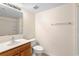 Well-lit bathroom featuring a vanity, toilet, and shower/tub combo at 1561 Randolph St, Deltona, FL 32725