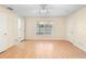 Bright bedroom with wood floors, large window, and plenty of closet space at 1561 Randolph St, Deltona, FL 32725
