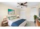 Cozy bedroom featuring a ceiling fan, white bed, and modern decor at 1561 Randolph St, Deltona, FL 32725