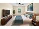 Bedroom showcasing a bed, side tables, area rug, and a large window at 1561 Randolph St, Deltona, FL 32725