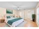 Modern bedroom with a white bed, stylish decor, and en suite bathroom at 1561 Randolph St, Deltona, FL 32725