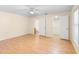 Spacious bedroom featuring light walls, wood floors, and a ceiling fan at 1561 Randolph St, Deltona, FL 32725