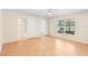 Light and airy bedroom featuring wood floors, ceiling fan, and lots of natural light at 1561 Randolph St, Deltona, FL 32725