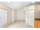 Open kitchen and dining area with tile flooring, pantry, and neutral paint at 1561 Randolph St, Deltona, FL 32725