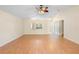 Spacious living room with a ceiling fan, hardwood floors, and an open floor plan at 1561 Randolph St, Deltona, FL 32725