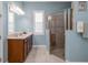 Stylish bathroom with a glass-enclosed shower, modern fixtures, and a vanity with ample counter space at 1653 Victoria Gardens Dr, Deland, FL 32724