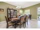Comfortable dining room featuring elegant decor and views to the outdoor living spaces at 1653 Victoria Gardens Dr, Deland, FL 32724