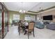 Open-concept dining area with abundant natural light and seamless access to the living space at 1653 Victoria Gardens Dr, Deland, FL 32724