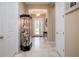 Welcoming foyer featuring neutral walls, tile flooring, and an elegant glass display case at 1653 Victoria Gardens Dr, Deland, FL 32724