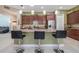 An open kitchen features pendant lighting, granite counters, and breakfast bar seating at 1653 Victoria Gardens Dr, Deland, FL 32724