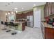 Modern kitchen featuring stainless steel appliances, granite countertops, and a breakfast bar with seating at 1653 Victoria Gardens Dr, Deland, FL 32724
