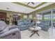 Comfortable living room featuring stylish seating and seamless access to the outdoor patio at 1653 Victoria Gardens Dr, Deland, FL 32724