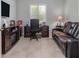 Well-lit home office with a modern desk, comfortable seating, and built-in storage at 1653 Victoria Gardens Dr, Deland, FL 32724