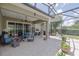 Relax on this screened patio with ample seating and views of the manicured backyard landscaping at 1653 Victoria Gardens Dr, Deland, FL 32724