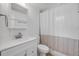 Clean white bathroom features shower with tub, white vanity and mirror at 173 Cedar Ave, Orange City, FL 32763
