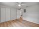 This bedroom includes wood floors, ceiling fan, closet and access door at 173 Cedar Ave, Orange City, FL 32763