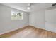 Bedroom with wood floors, ceiling fan, closet and one window at 173 Cedar Ave, Orange City, FL 32763