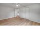 Bright bedroom features wood floors, ceiling fan, closet and door to hall at 173 Cedar Ave, Orange City, FL 32763