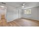 Bedroom featuring wood flooring, and views to the en-suite bath and closet at 173 Cedar Ave, Orange City, FL 32763