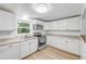 Clean kitchen featuring bright cabinetry, new appliances, and updated countertops for an easy cooking experience at 173 Cedar Ave, Orange City, FL 32763