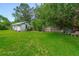 Large backyard with a shed and a wood fence at 1730 Birmingham Ave, Daytona Beach, FL 32117