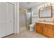 Bathroom with a walk-in shower and wooden vanity at 1730 Birmingham Ave, Daytona Beach, FL 32117