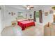 Bedroom featuring neutral toned tile floors, minimalist decor, and natural light at 1730 Birmingham Ave, Daytona Beach, FL 32117