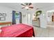 Bright bedroom with tile flooring, ceiling fan, and natural light at 1730 Birmingham Ave, Daytona Beach, FL 32117