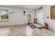 Bright entryway with tiled floors, a plant, and view of the front door at 1730 Birmingham Ave, Daytona Beach, FL 32117
