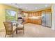 Kitchen with wooden cabinets, stainless steel appliances, and a view of the backyard at 1730 Birmingham Ave, Daytona Beach, FL 32117
