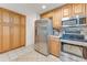 Kitchen showcasing stainless steel refrigerator, oven, microwave and ample cabinet space at 1730 Birmingham Ave, Daytona Beach, FL 32117