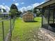 View of a fenced backyard featuring a storage shed at 1887 Viking Ave, Deltona, FL 32725