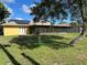 Spacious backyard with screened-in patio and solar panels on the roof at 1887 Viking Ave, Deltona, FL 32725