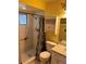 Cheerful bathroom with tiled shower, sink, toilet, and storage at 1887 Viking Ave, Deltona, FL 32725