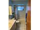 Bathroom with tiled bathtub and walls, and vanity sink at 1887 Viking Ave, Deltona, FL 32725