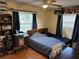 Bedroom with wood floors, built-in shelving and window with view at 1887 Viking Ave, Deltona, FL 32725