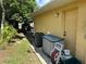 View of the back side of the home with access door and storage on the side of the house at 1887 Viking Ave, Deltona, FL 32725