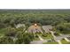 Beautiful aerial view showcasing lush green surroundings, expansive property, and prime location at 19 Tomoka Cove Way, Ormond Beach, FL 32174