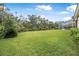Lush, green backyard offering ample space for outdoor activities and relaxation at 19 Tomoka Cove Way, Ormond Beach, FL 32174