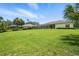Well-maintained lawn and landscaping offer privacy and room for outdoor enjoyment at 19 Tomoka Cove Way, Ormond Beach, FL 32174