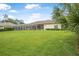 Expansive backyard featuring a screened-in pool area, perfect for enjoying outdoor living at 19 Tomoka Cove Way, Ormond Beach, FL 32174