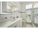 Bright bathroom features stylish vanity, and shower with access to the outside at 19 Tomoka Cove Way, Ormond Beach, FL 32174