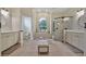 Elegant bathroom with double vanity, soaking tub, and walk-in shower at 19 Tomoka Cove Way, Ormond Beach, FL 32174