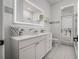 Elegant bathroom with white marble countertops, soft-close drawers, and modern lighting at 19 Tomoka Cove Way, Ormond Beach, FL 32174