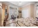 Beach-themed bedroom boasts a ceiling fan, built-in shelving, and a large closet at 19 Tomoka Cove Way, Ormond Beach, FL 32174